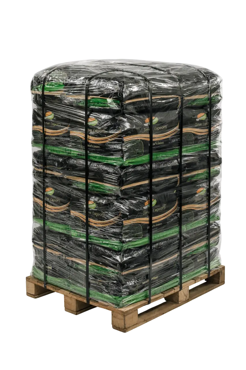 A heavy-duty wooden pallet stacked with multiple bags of Zenon Exports products, securely wrapped in clear plastic shrink wrap for safe wholesale international shipping.